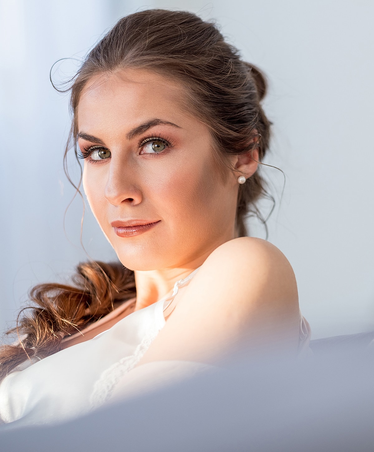 Portrait of a woman with natural makeup and hairstyle.