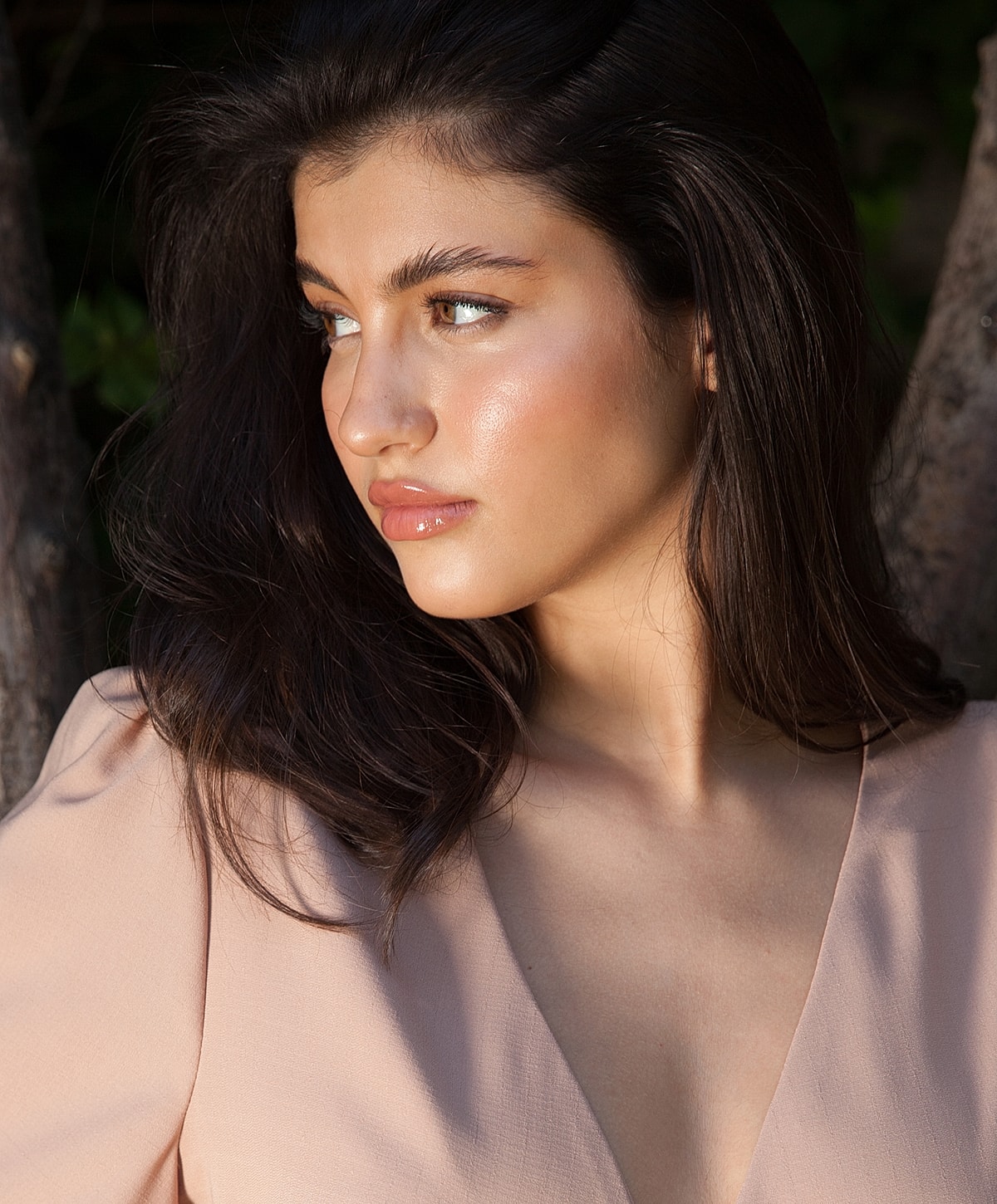 Portrait of a woman with long, dark hair.