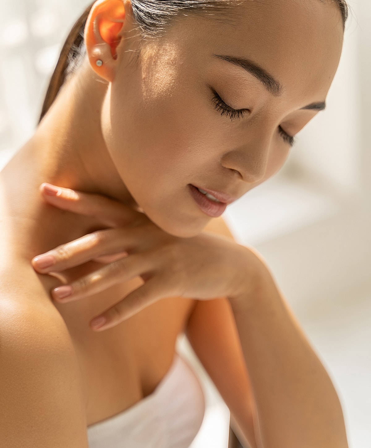Woman with closed eyes and serene expression.
